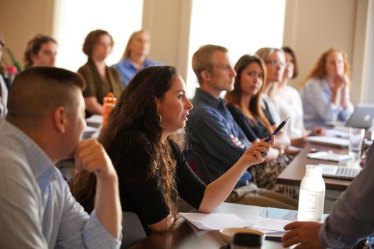 A student asking a question in a classroom